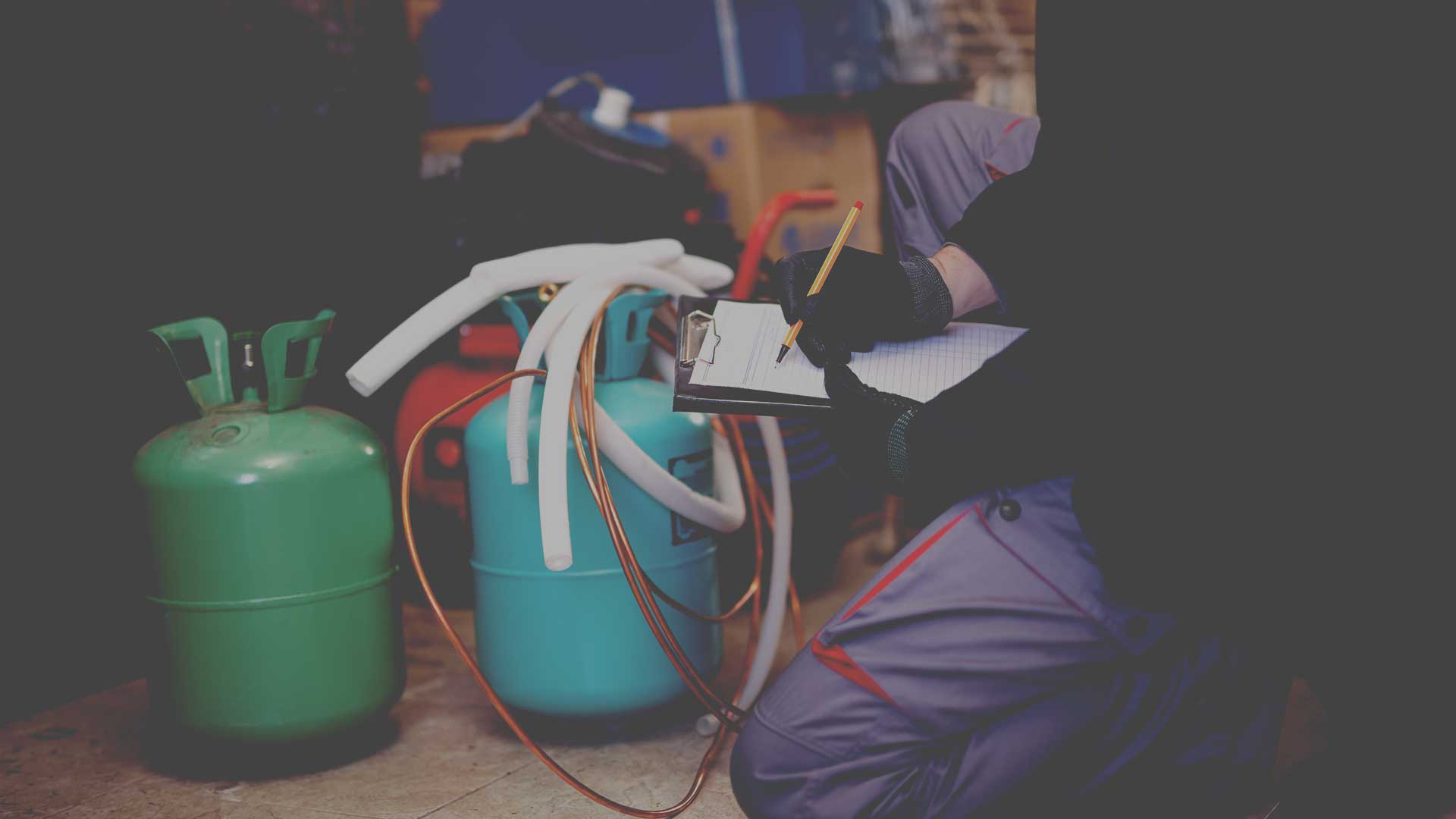 HVAC technician inspecting equipment